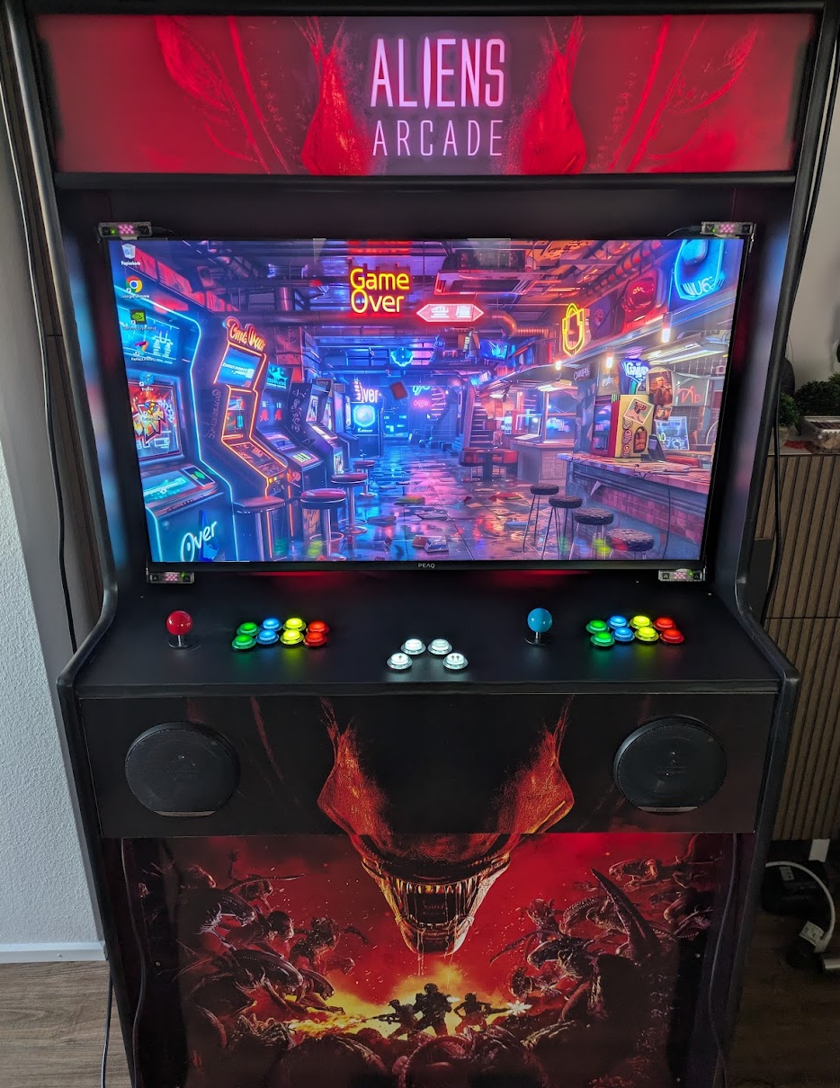 Cabinet with arcade buttons and joystick as well as the custom-printed marquee with the Aliens Arcade lettering